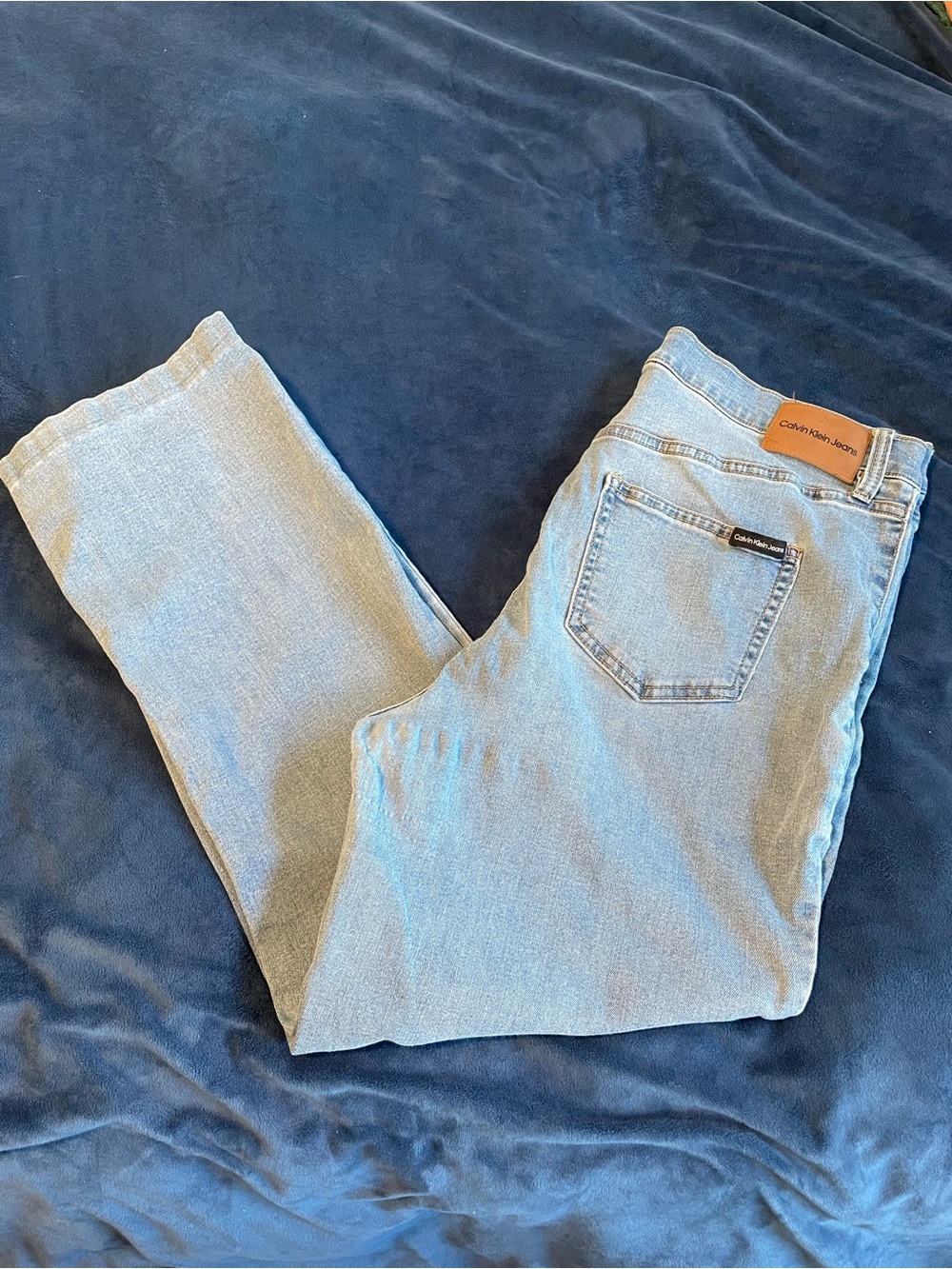 Calvin Klein Light Blue Denim Jeans with Leather Patch